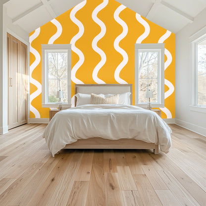 Vaulted bedroom with the Saffron Sway pattern behind the bed, showing large-scale vertical rhythm