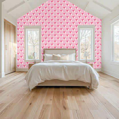 Bedroom accent wall covered in Petal Heart Grid wallpaper behind a simple wood bed with vaulted ceiling