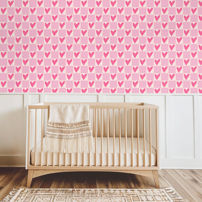 Nursery wall preview with Petal Heart Grid above a wooden crib and white wainscoting