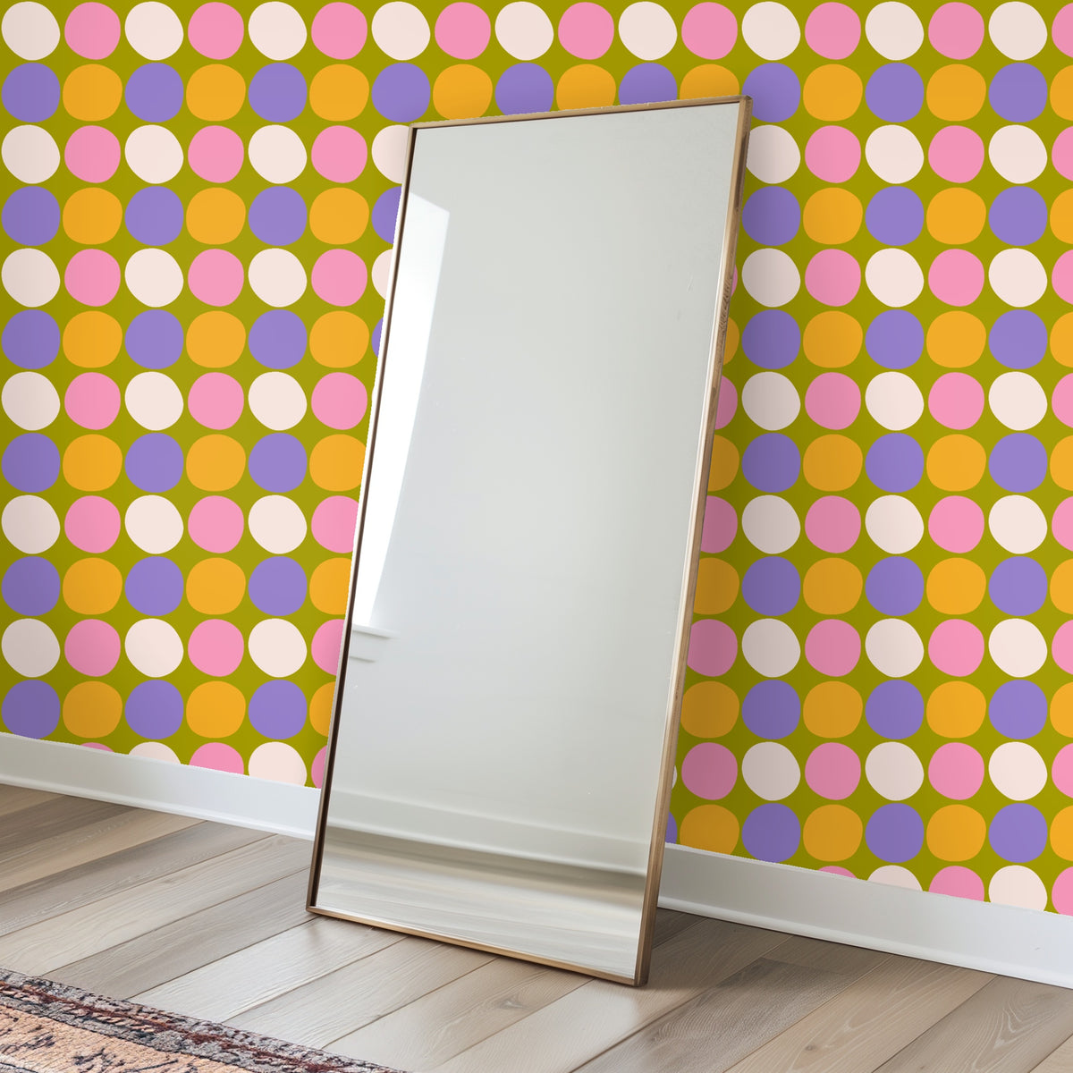 Full repeat of Sweet Orchard Polka wallpaper: olive background with hand-edged dots in pink, cream, lavender and orange
