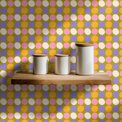 Floor mirror leaning against a wall covered in the polka dot pattern, reflecting the olive and pastel dots