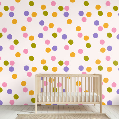 Laundry room wall with window and shelving, wallpapered in scattered polka dots in pink, purple, orange and olive