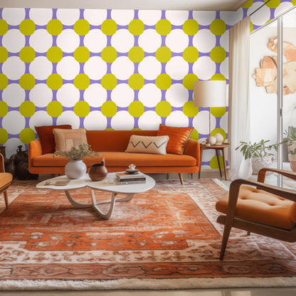 Blue velvet sofa placed against the Marigold Orbit wallpaper showing color contrast and scale