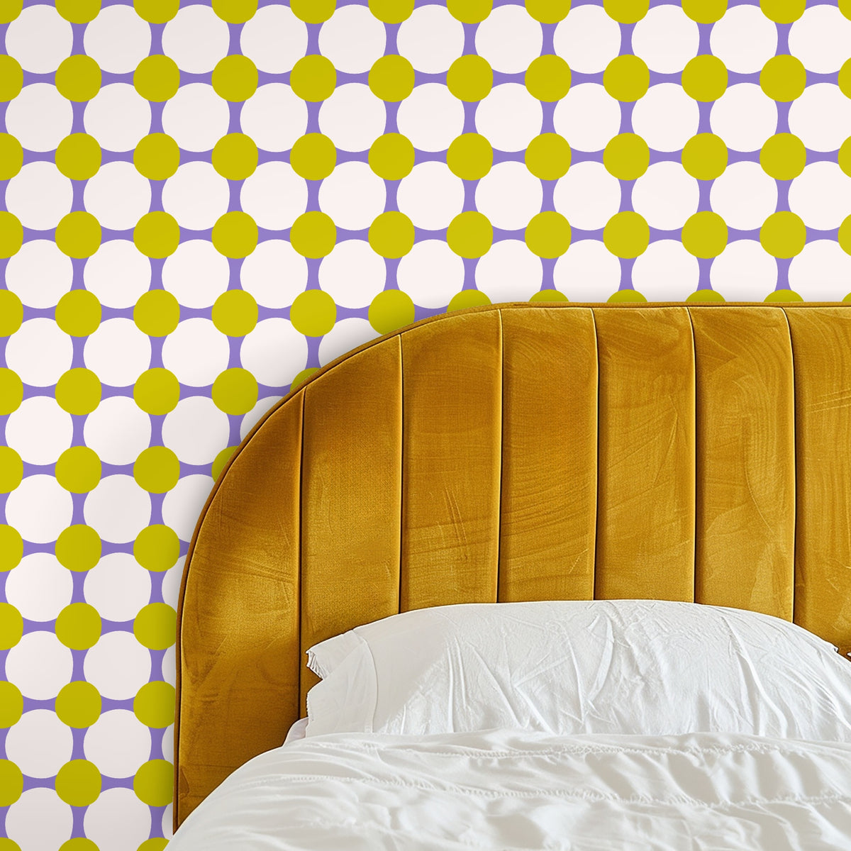 Bedroom accent wall behind a mustard velvet channel headboard with the chartreuse-and-lilac geometric wallpaper