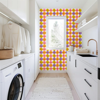 Kitchen vignette with Orbit Lattice wallpaper behind a wooden shelf and pitcher, demonstrating the pattern as a spirited backsplash-style
