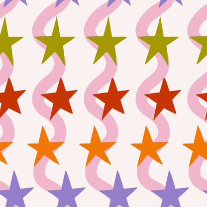 Detail image focused on a staggered row of lavender and orange stars over the pink ribbon repeat against the blush field