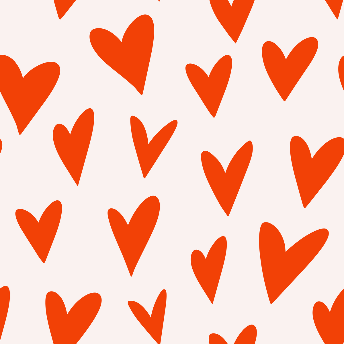 Scale study showing repeated orange hearts at eye-level on a pale blush wall.