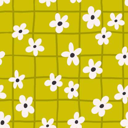 Living room full-wall installation: chartreuse wallpaper with olive grid and cream daisies behind a neutral linen sofa