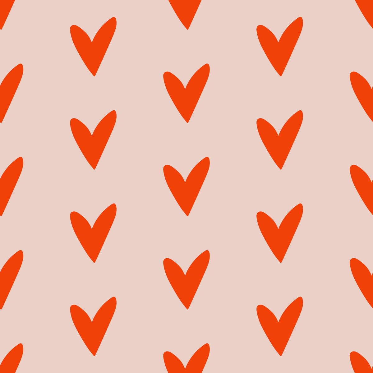 Pattern swatch mockup showing the overall repeat and color contrast between tomato red hearts and pale blush ground.
