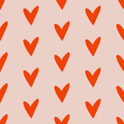 Pattern swatch mockup showing the overall repeat and color contrast between tomato red hearts and pale blush ground.