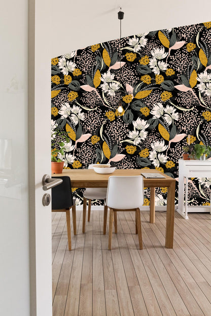 Close-up detail of white blooms and mustard clusters against black in wallpaper pattern.